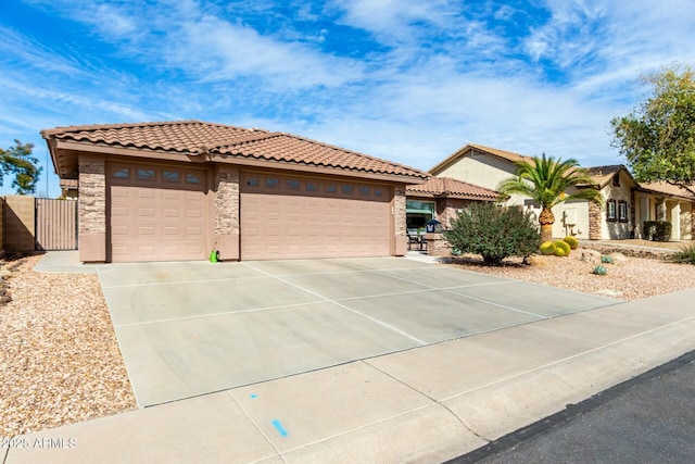 mediterranean / spanish-style home with a garage