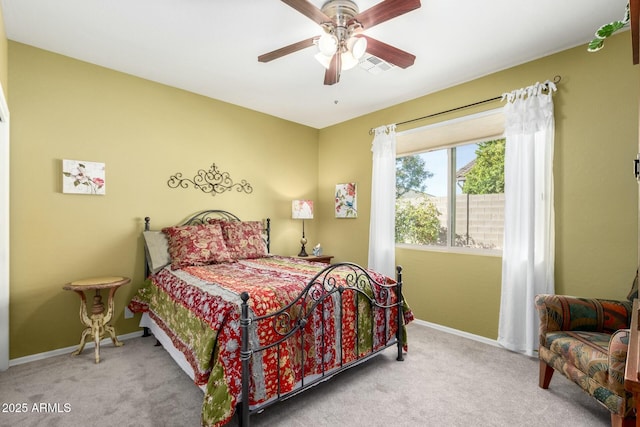 bedroom with ceiling fan and light colored carpet