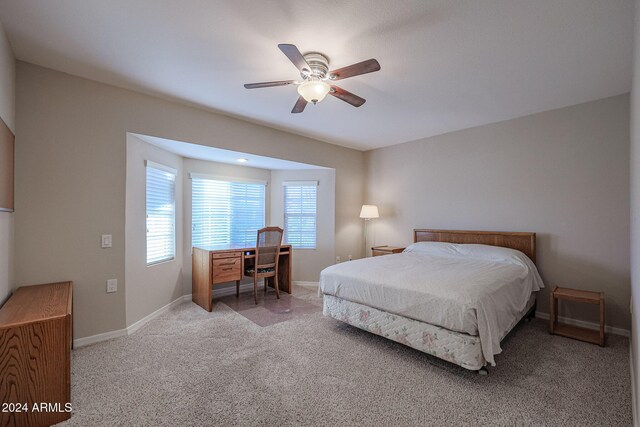 bedroom featuring ceiling fan and light carpet