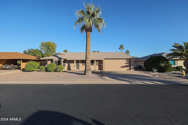 ranch-style home with a garage