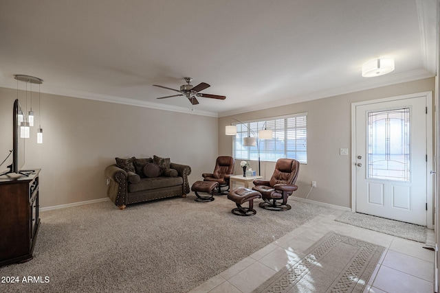 tiled living room with ceiling fan and ornamental molding