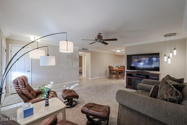 carpeted living room with ceiling fan and crown molding