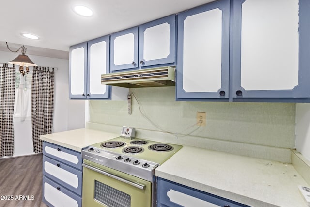 kitchen with light countertops, electric range, blue cabinetry, and under cabinet range hood