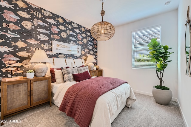 carpeted bedroom featuring baseboards