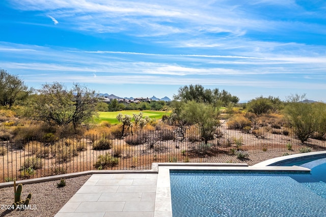 view of pool featuring a patio area, fence, and a fenced in pool