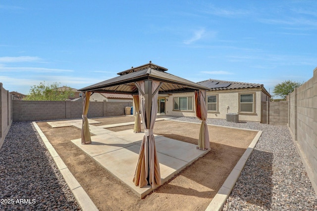 view of patio / terrace featuring central air condition unit, a gazebo, and a fenced backyard