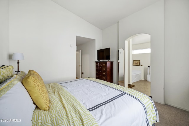 23862 W Chambers St, Buckeye, AZ 85326 - bedroom with arched walkways, carpet flooring, high vaulted ceiling, and connected bathroom