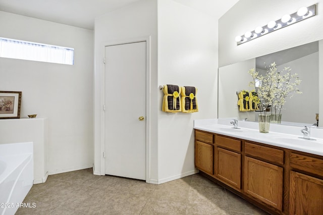 23862 W Chambers St, Buckeye, AZ 85326 - full bathroom with a bath, double vanity, tile patterned floors, and baseboards