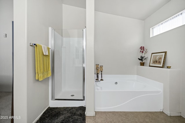 23862 W Chambers St, Buckeye, AZ 85326 - bathroom featuring a stall shower, a bath, baseboards, and tile patterned floors