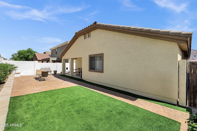 23862 W Chambers St, Buckeye, AZ 85326 - rear view of property featuring a patio area, stucco siding, and a gate