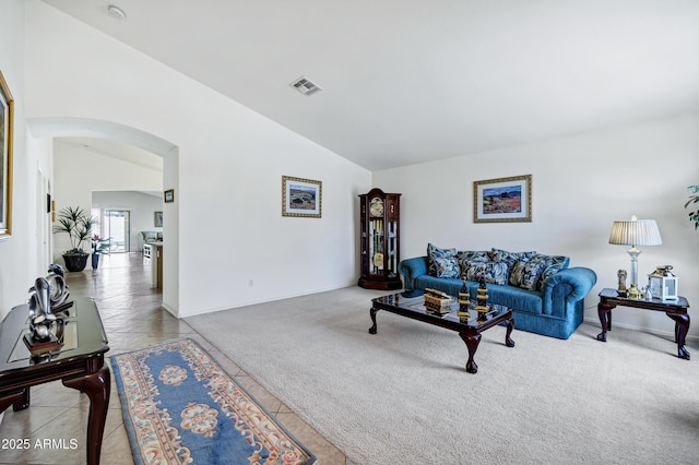 23862 W Chambers St, Buckeye, AZ 85326 - living room with arched walkways, lofted ceiling, carpet, and baseboards