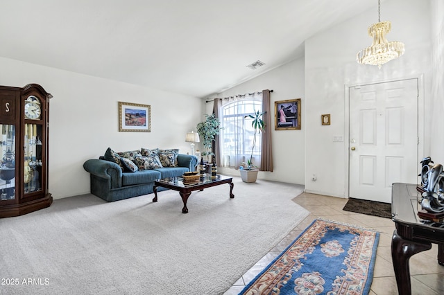 23862 W Chambers St, Buckeye, AZ 85326 - carpeted living room with vaulted ceiling, a chandelier, and tile patterned floors
