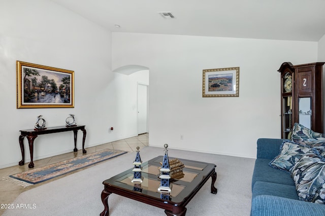 23862 W Chambers St, Buckeye, AZ 85326 - living room with arched walkways, light carpet, and lofted ceiling