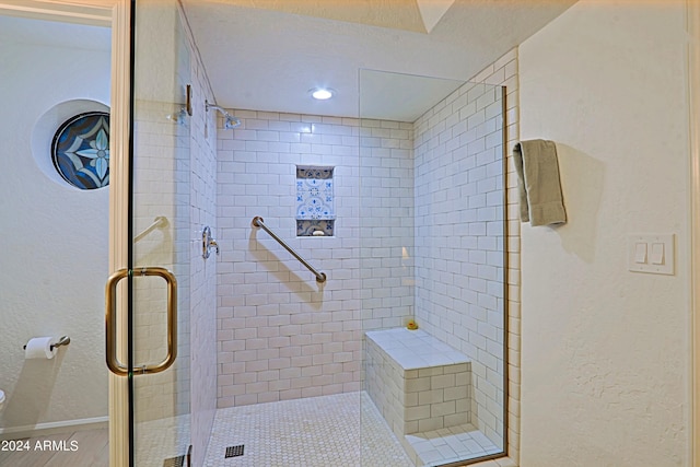 bathroom featuring an enclosed shower