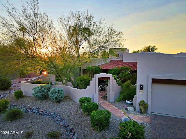 view of front of property with a garage