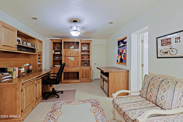 office space with a textured ceiling