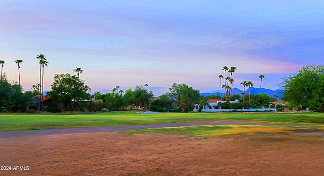 view of community featuring a yard and a mountain view