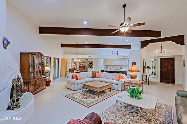 living room featuring light wood-type flooring, ceiling fan with notable chandelier, and beam ceiling