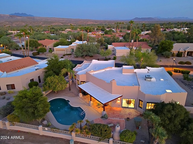 birds eye view of property with a mountain view