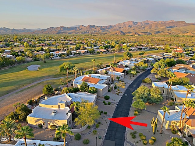 birds eye view of property with a mountain view