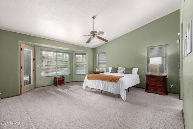 carpeted bedroom with ceiling fan, access to outside, and lofted ceiling