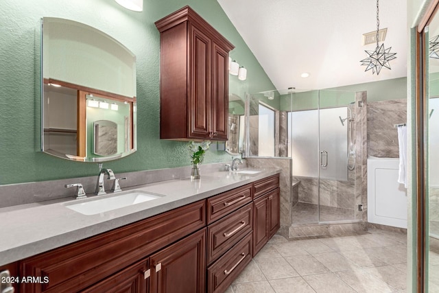 bathroom featuring vanity, tile patterned floors, and a shower with shower door