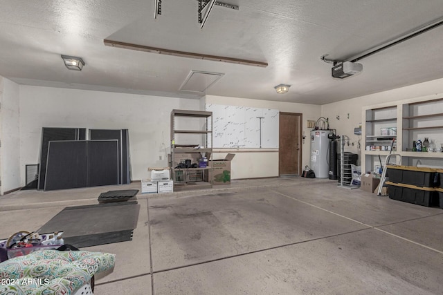 garage featuring a garage door opener and water heater