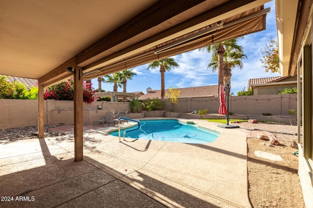 view of swimming pool with a patio