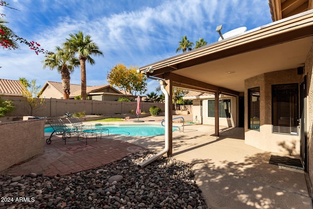 view of swimming pool featuring a patio