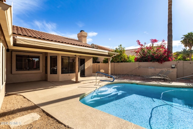 view of pool featuring a patio