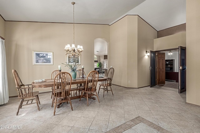 tiled dining space with a chandelier