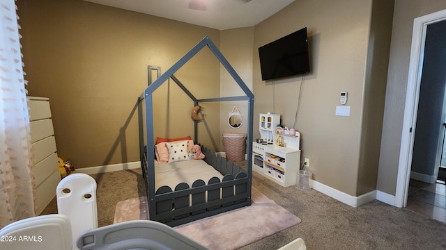 carpeted bedroom with baseboards