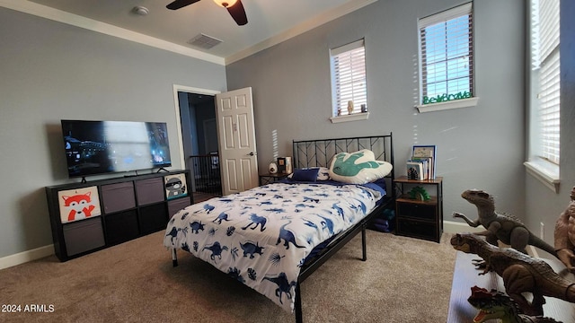 bedroom with carpet floors, ornamental molding, visible vents, and baseboards