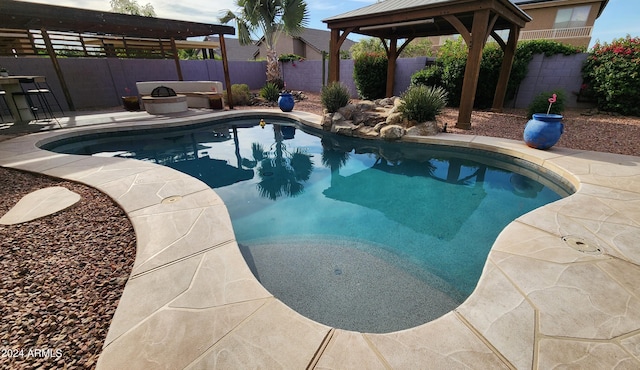 view of swimming pool with a gazebo, a patio, a fenced backyard, and a fenced in pool