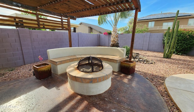 view of patio with an outdoor fire pit and a fenced backyard