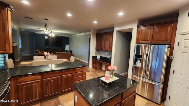 kitchen with visible vents, open floor plan, a center island, stainless steel refrigerator with ice dispenser, and recessed lighting