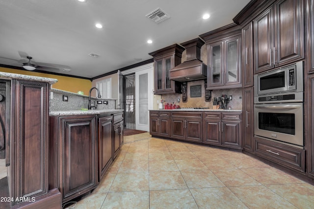 kitchen featuring stainless steel appliances, dark brown cabinets, light tile patterned flooring, custom range hood, and ornamental molding