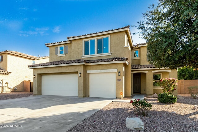 mediterranean / spanish-style home featuring a garage