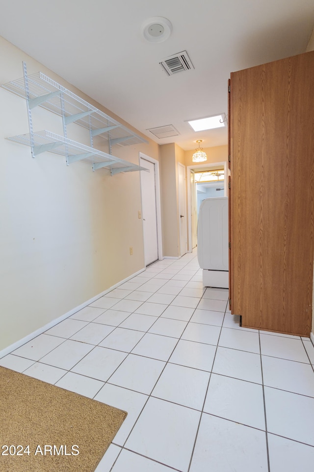 spare room with light tile patterned floors