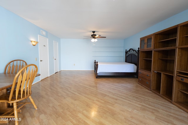 bedroom featuring ceiling fan and light hardwood / wood-style floors