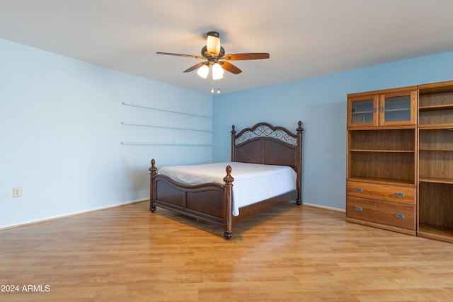 bedroom featuring ceiling fan and light hardwood / wood-style floors