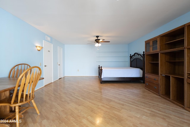 bedroom with ceiling fan and light hardwood / wood-style floors