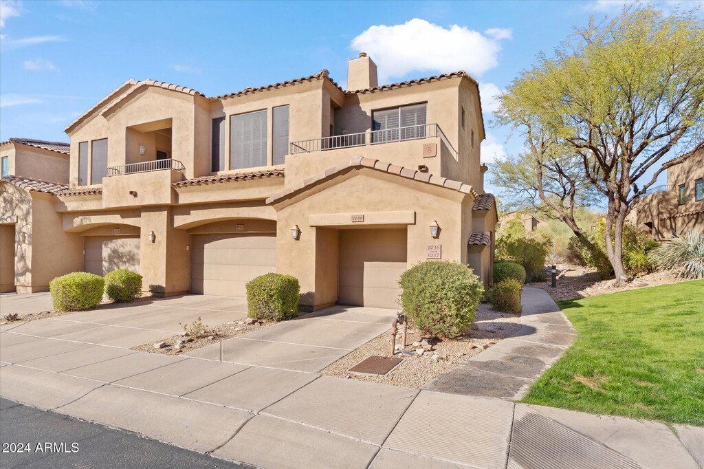 16600 N Thompson Peak Pkwy Unit 2036, Scottsdale, AZ 85260 - mediterranean / spanish-style home with a garage and a balcony