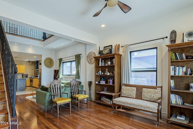 interior space featuring ceiling fan, wood-type flooring, and a wealth of natural light