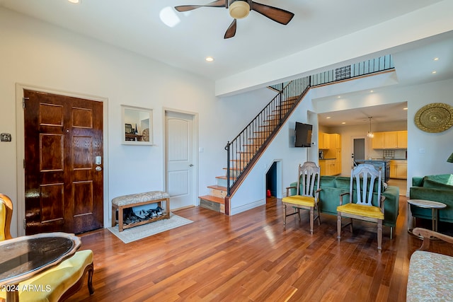 foyer featuring ceiling fan and wood-type flooring