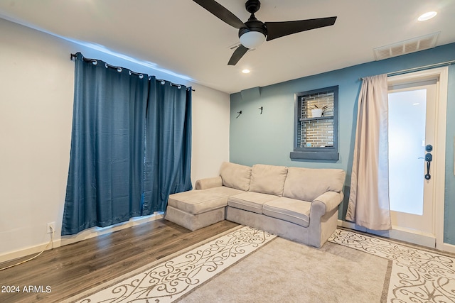 living room with ceiling fan and hardwood / wood-style floors