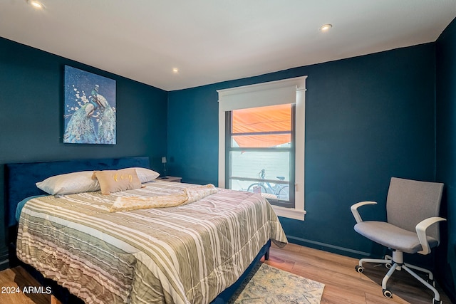 bedroom with light hardwood / wood-style flooring