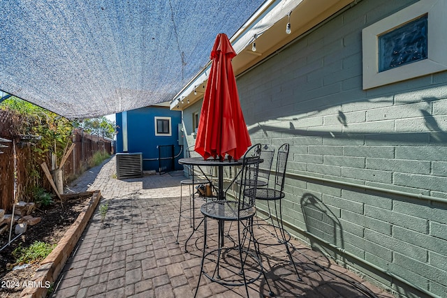 view of patio with central AC unit