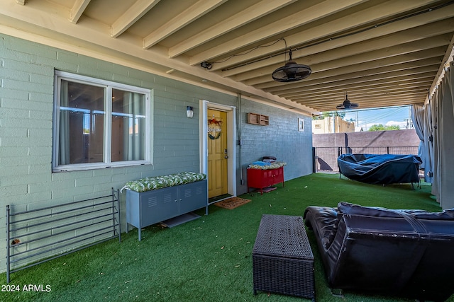 view of patio featuring ceiling fan