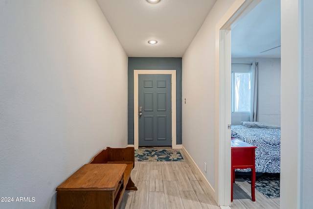 doorway to outside with light wood-type flooring